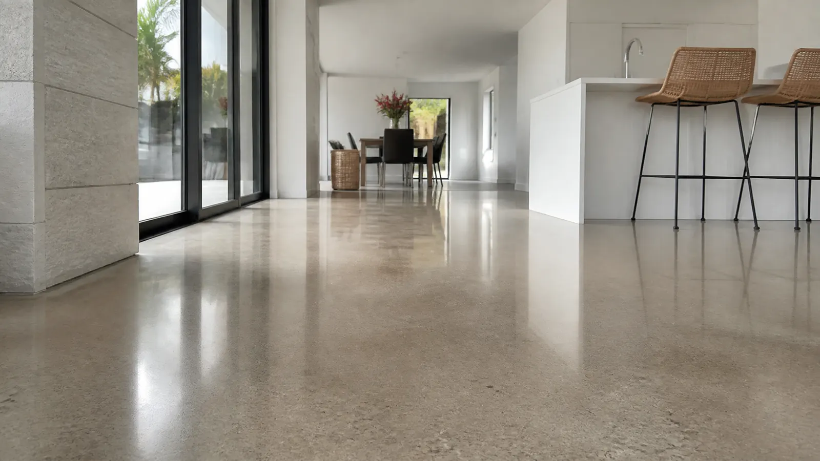 Side by side floor sections showing grind and seal satin finish versus mechanically polished high gloss concrete finish comparison